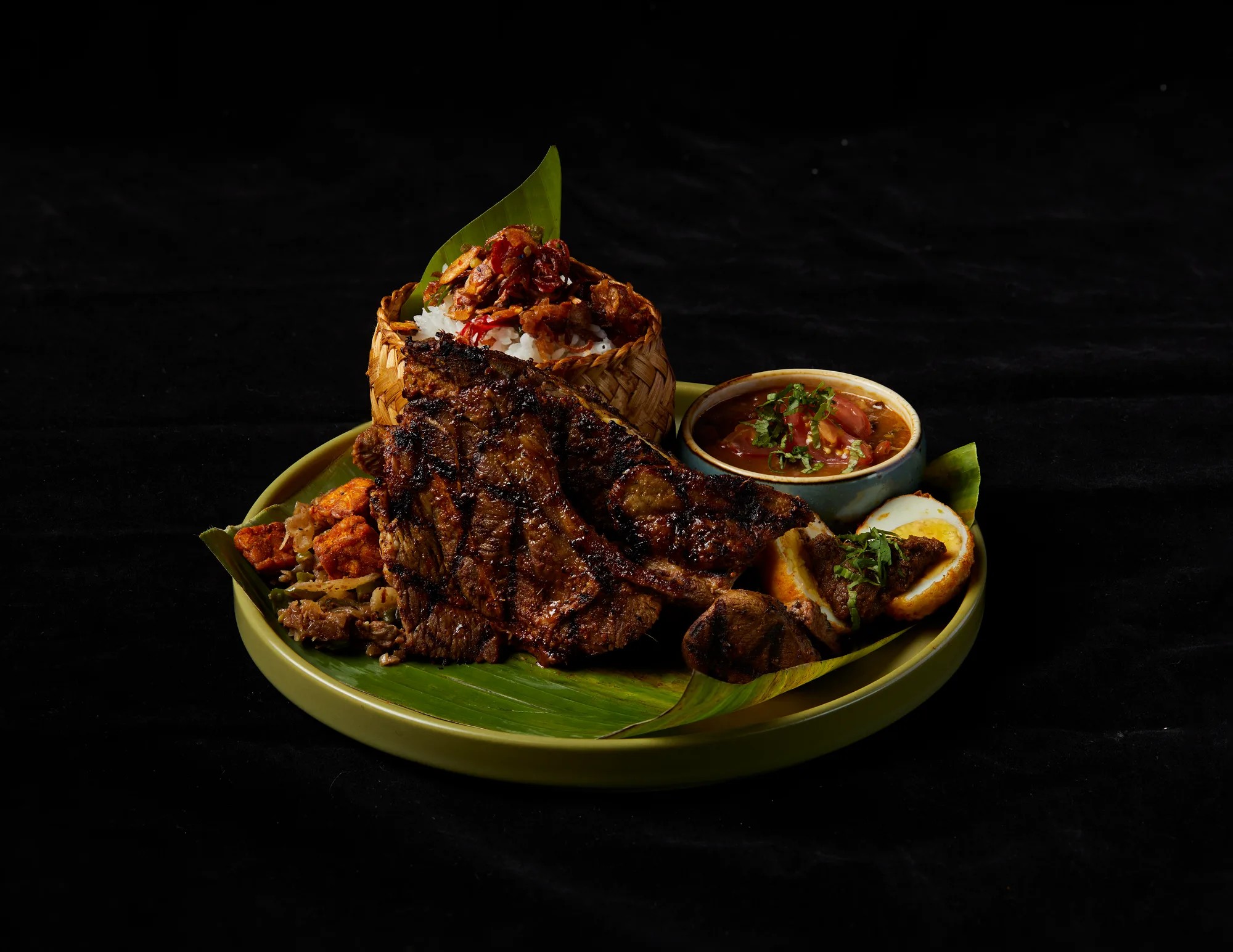 Signature Balinese platter served on banana leaf at BumbuBali Malaysia